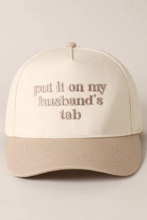 Put It On My Husband's Tab Beige Embroidered Trucker Hat